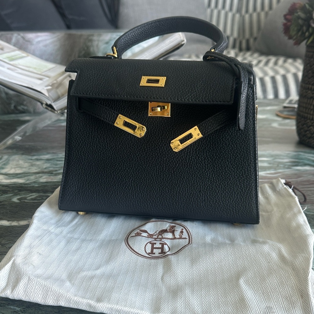 Textured Black Togo Leather Mini bag with Gold lock and Accents